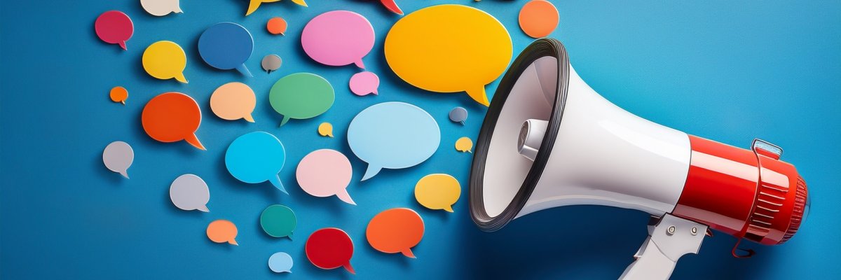 powerful megaphone with an array of colorful speech bubbles of varying shapes and sizes radiating outward on a solid blue background representing the concept of powerful messaging communication